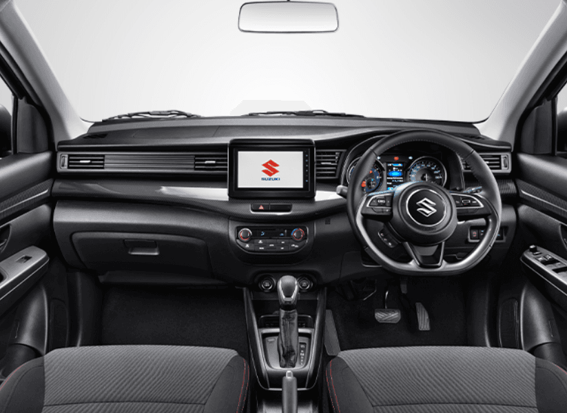 Interior All New Ertiga Cruise tampil elegan dengan kabin dominan hitam yang sporty. Dilengkapi aksen charcoal, panel instrumen berdesain modern, head unit 8 inci, ventilasi AC belakang, serta ruang kabin lega yang nyaman untuk 7 penumpang.